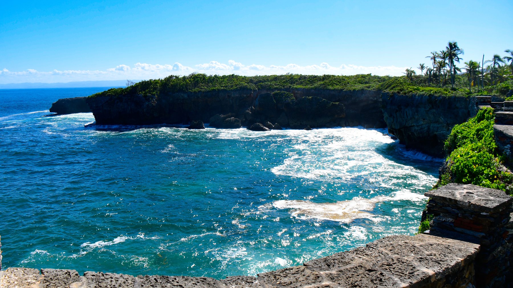 Turquoise water in the cove below the old fort wall, Samaná